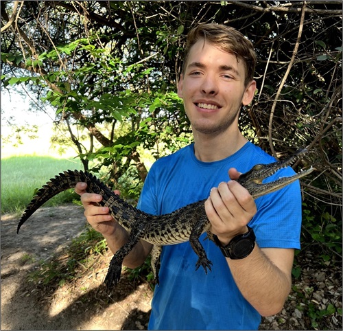 Bernie Jordaan holding a juvenile Crocodylus niloticus colleced in Northern Namibia